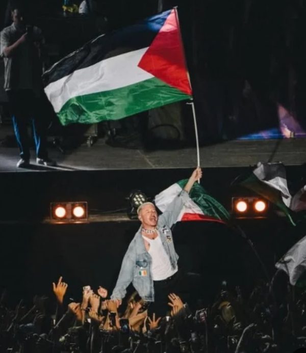 ماكليمور يحمل علم فلسطين